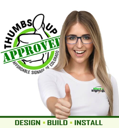 A blonde woman wearing a t-shirt and glasses makes a thumbs-up gesture with the thumbs-up approved affordable logo in the background.